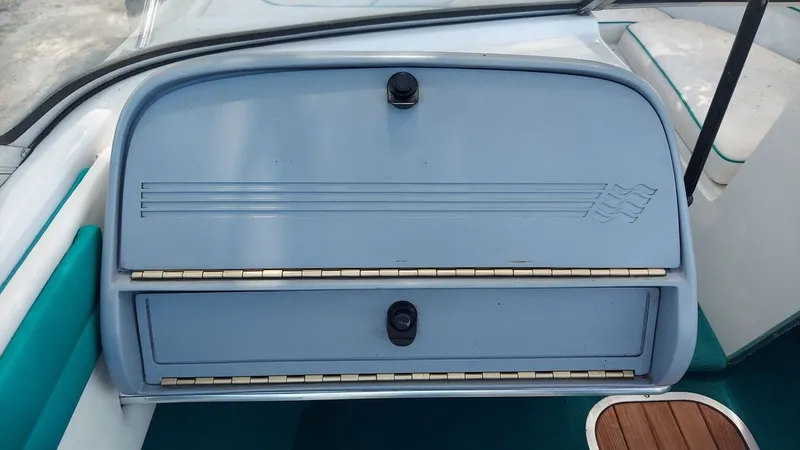 Slide: The Image of The image shows a boat's dashboard with a blue cover and wood details. - 4