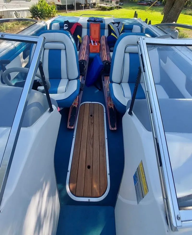 Slide: The Image of Interior view of a 1992 Four Winns 190 Horizon with blue and white seats and water skis. - 3