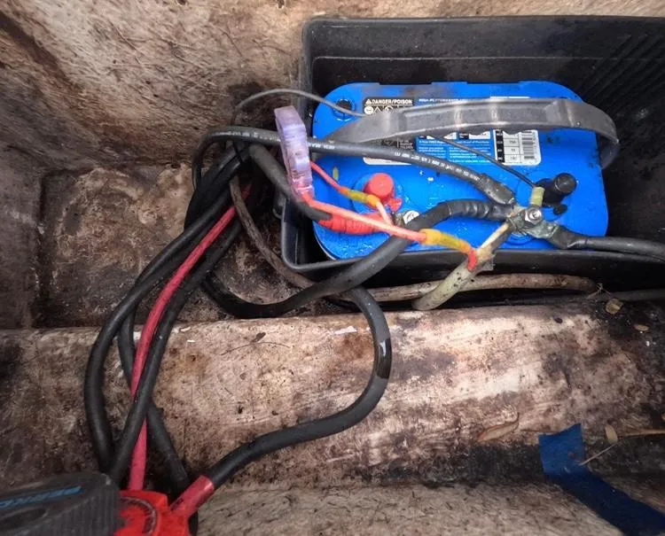 Slide: The Image of Battery compartment of 2004 Twin Vee 26 Center Console with visible wiring. - 44