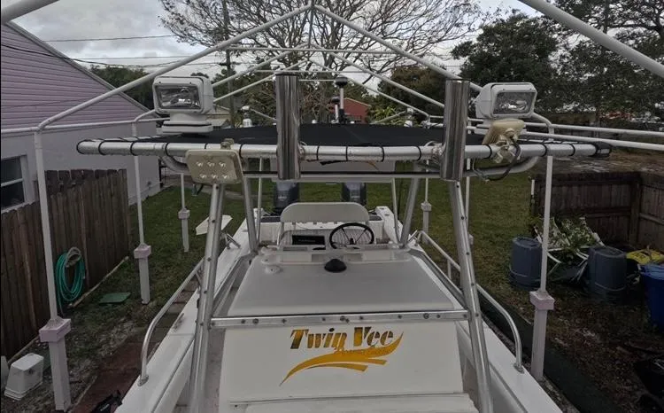Slide: The Image of 2004 Twin Vee 26 Center Console boat with T-top and mounted lights. - 27