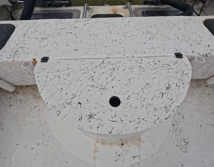 Slide: The Image of 2004 Twin Vee 26 Center Console boat deck with storage compartment. - 41