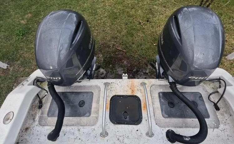 Slide: The Image of 2004 Twin Vee 26 Center Console with dual outboard motors, viewed from above. - 47