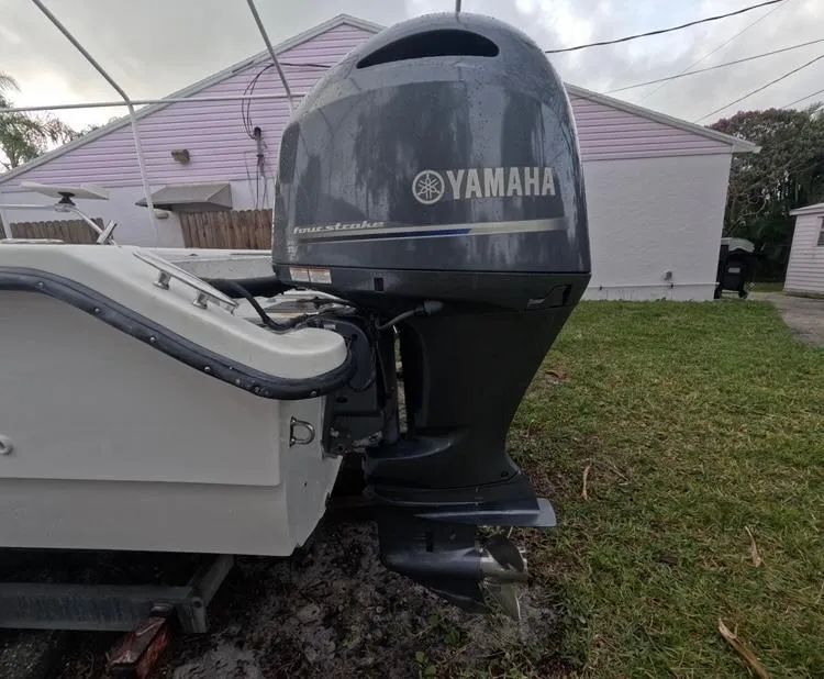 Slide: The Image of A Yamaha outboard motor is attached to a boat on a trailer. - 50