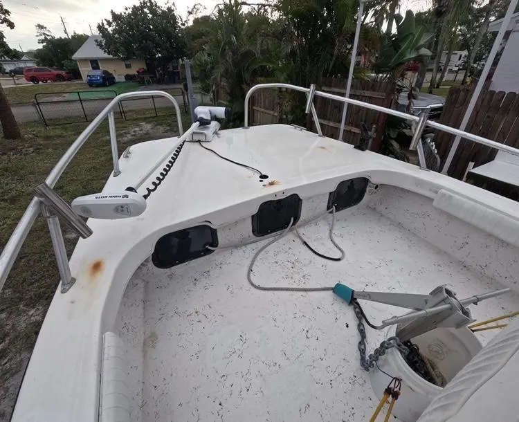 Slide: The Image of 2004 Twin Vee 26 Center Console boat deck with anchor and railing. - 22