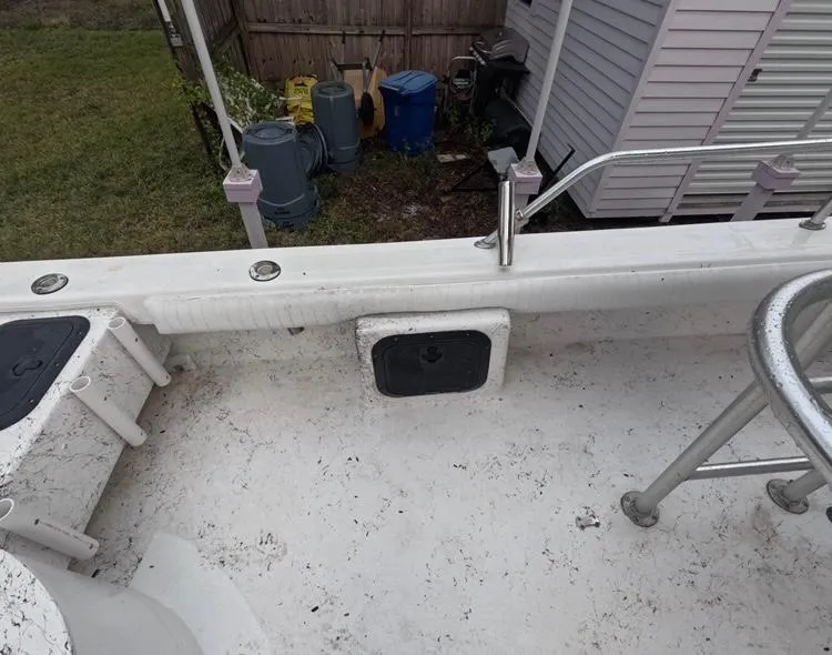 Slide: The Image of 2004 Twin Vee 26 Center Console boat interior, showing deck and railing details. - 36