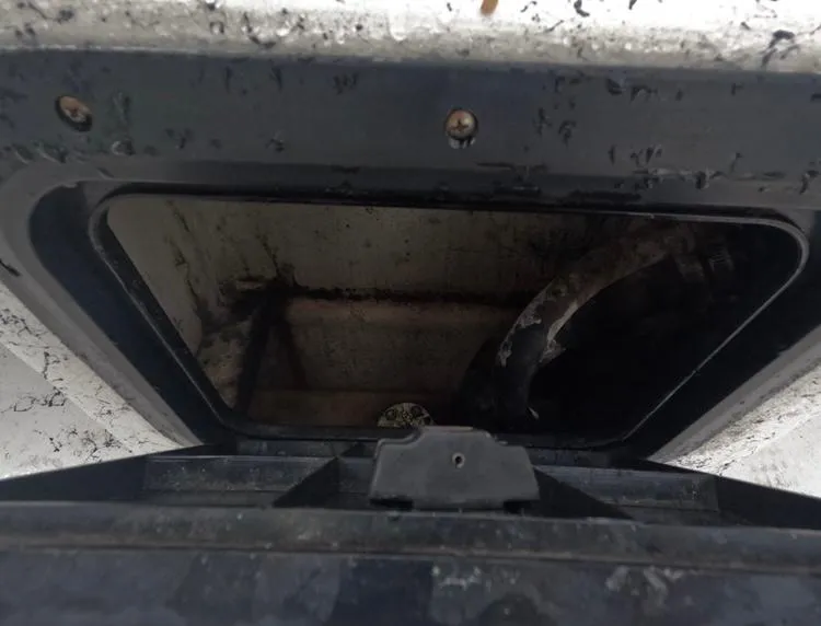 Slide: The Image of 2004 Twin Vee 26 Center Console storage compartment, showing interior details and condition. - 40