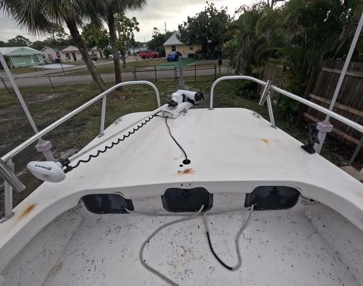 Slide: The Image of 2004 Twin Vee 26 Center Console boat deck with railing and equipment. - 23