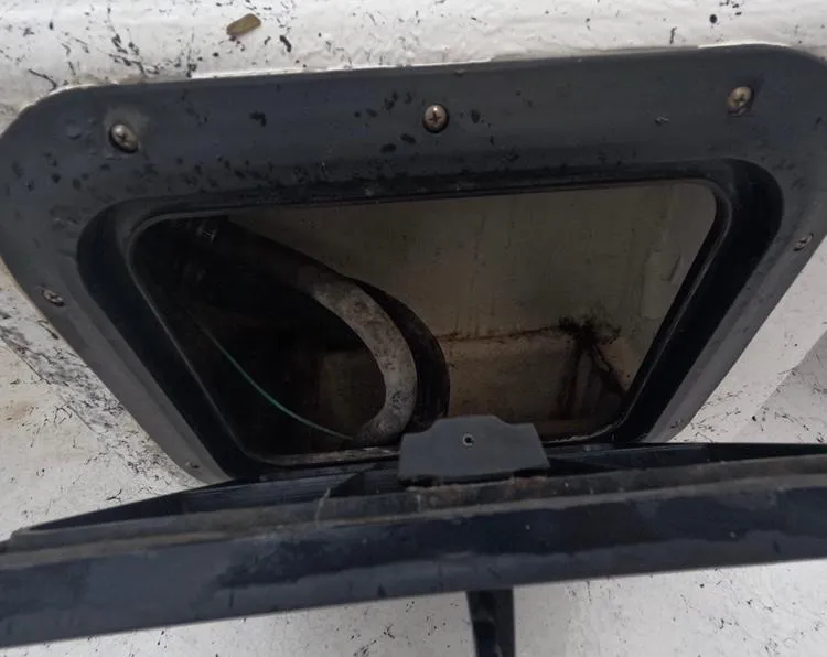 Slide: The Image of Inspection hatch of a 2004 Twin Vee 26 Center Console boat. - 37