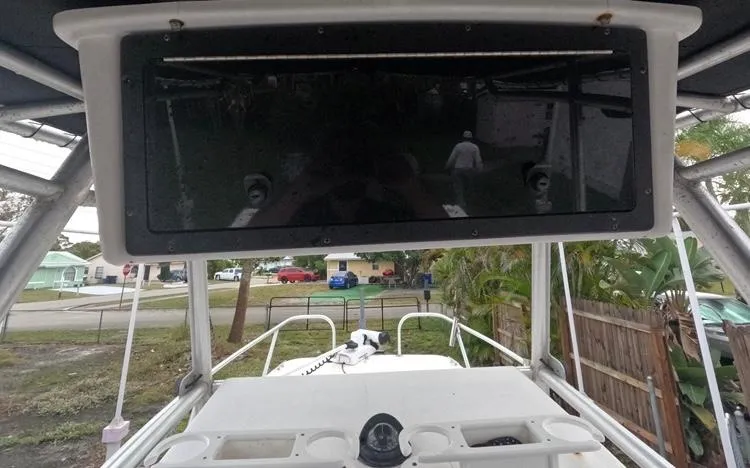 Slide: The Image of 2004 Twin Vee 26 Center Console boat, view of helm and electronics enclosure. - 17