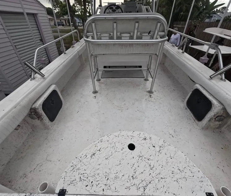 Slide: The Image of 2004 Twin Vee 26 Center Console boat interior with spacious deck and seating. - 13