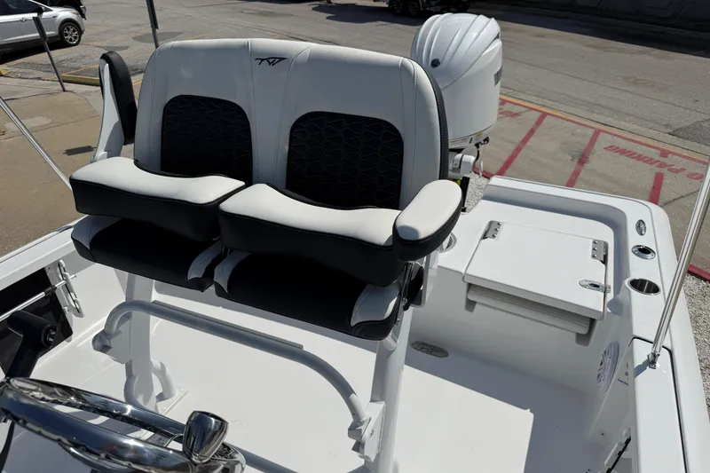 Slide: The Image of 2027 Tidewater 2110 Bay Max boat interior with dual seats and steering wheel. - 6