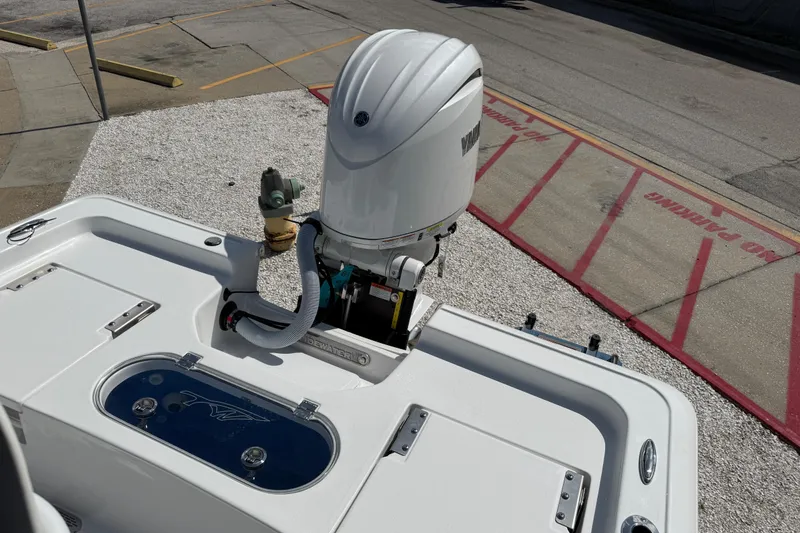 Slide: The Image of 2027 Tidewater 2110 Bay Max boat with Yamaha outboard motor in a parking area. - 7