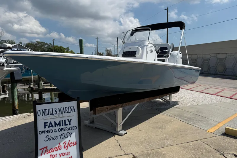 The Image of 2027 Tidewater 2110 Bay Max boat displayed at O'Neill's Marina under a cloudy sky. - 1