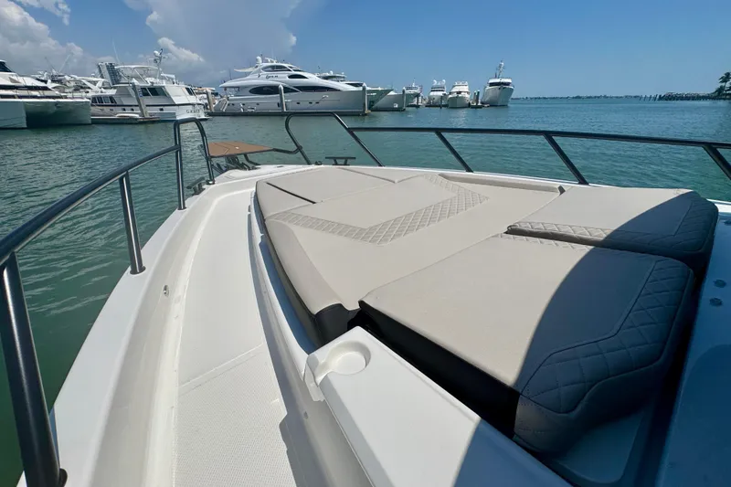 Slide: The Image of Luxury Navan C30 yacht deck with sunbathing area, docked in marina, 2026 model. - 52