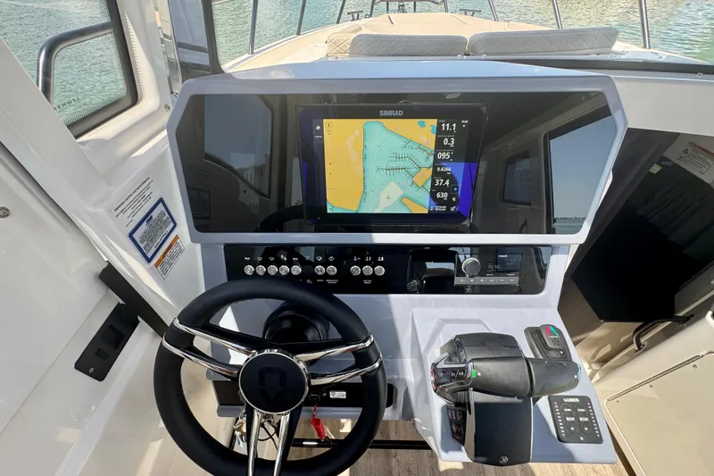 Slide: The Image of Helm of 2026 Navan C30 boat with navigation display and controls. - 34