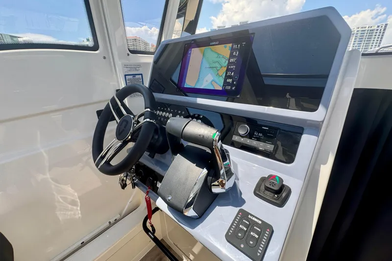Slide: The Image of Navan C30 2026 boat dashboard with steering wheel, navigation display, and control panel. - 35
