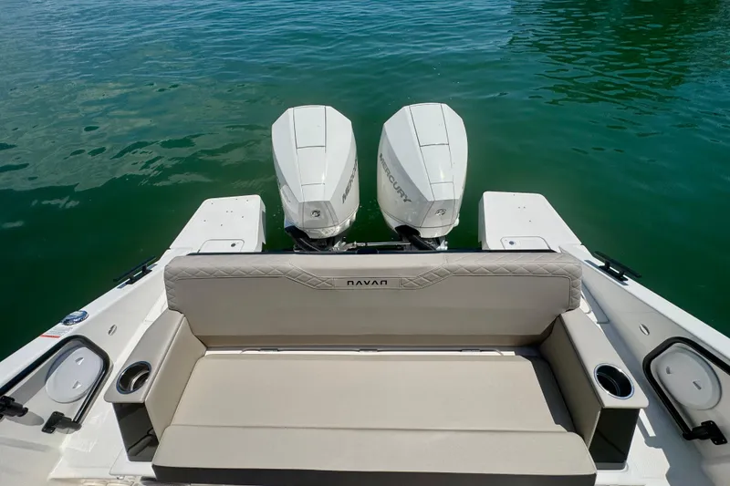 Slide: The Image of Navan C30 2026 boat with dual Mercury outboard engines on calm water. - 13