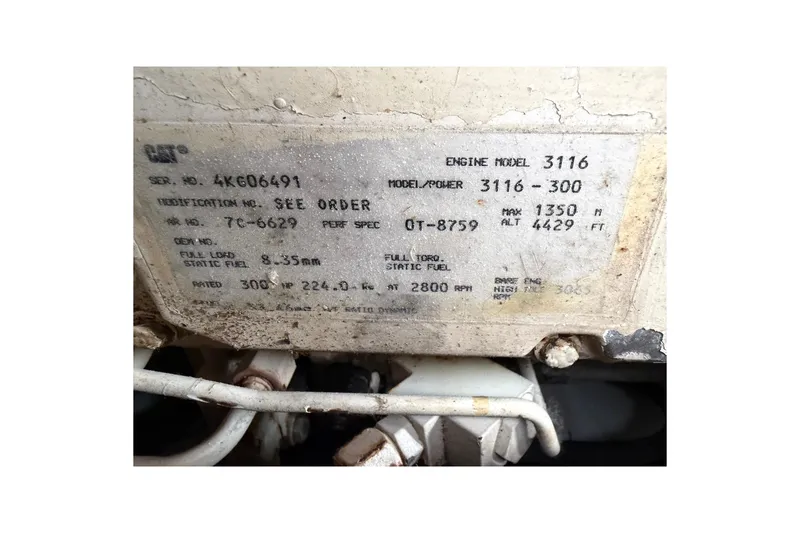 Slide: The Image of Engine plate of a 1998 Sabreline 36 Fast Trawler, model 3116-300. - 38