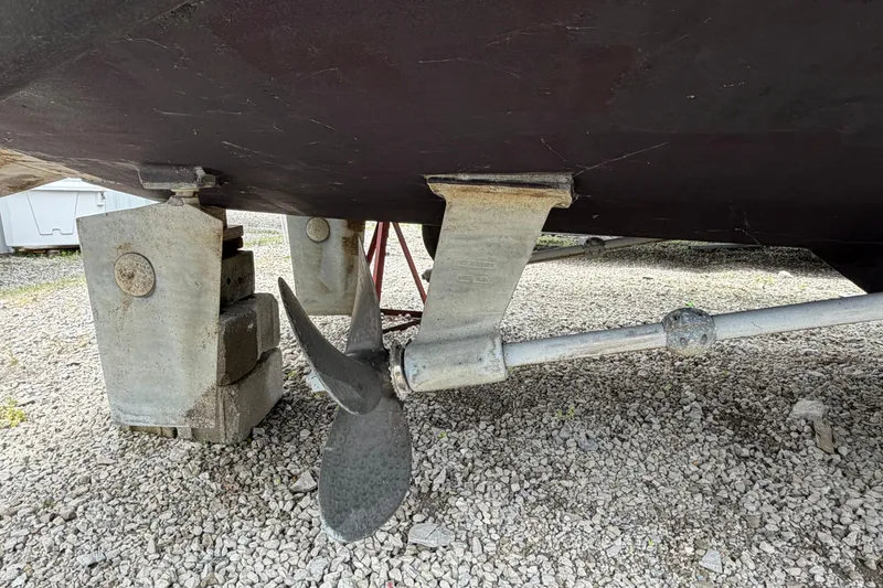Slide: The Image of Propeller and rudder of 1998 Sabreline 36 Fast Trawler on gravel. - 7