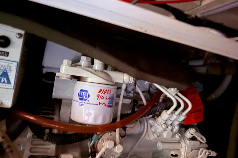 Slide: The Image of Engine compartment of 1998 Sabreline 36 Fast Trawler with NAPA filter visible. - 43