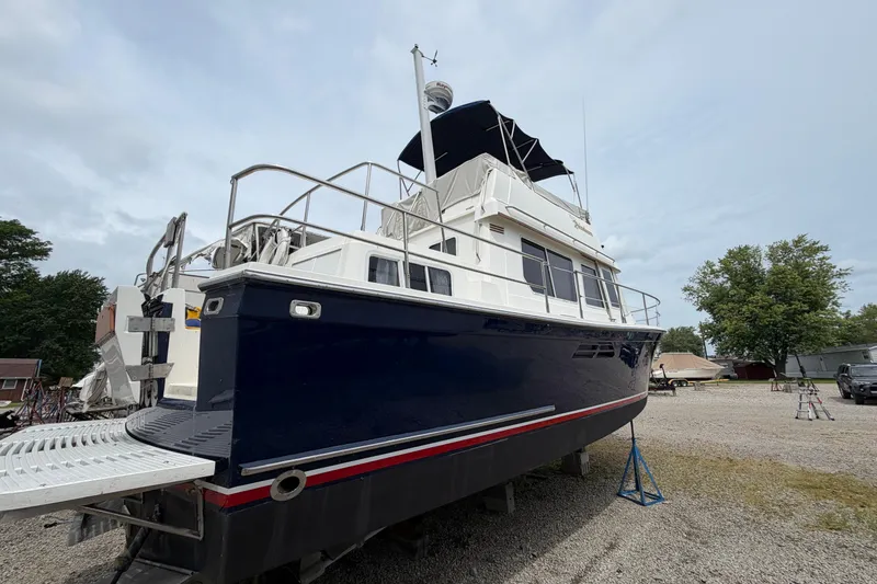 Slide: The Image of 1998 Sabreline 36 Fast Trawler on land, showcasing its sleek design and sturdy build. - 5
