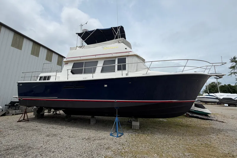 The Image of 1998 Sabreline 36 Fast Trawler on dry dock, blue hull, white superstructure. - 0
