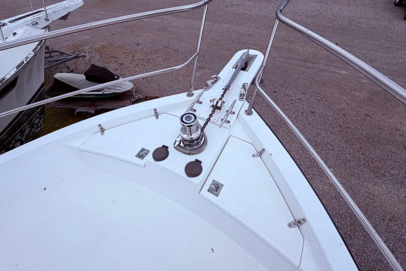 Slide: The Image of Bow of 1998 Sabreline 36 Fast Trawler with anchor chain and winch. - 14