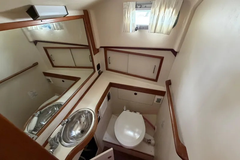 Slide: The Image of Bathroom interior of 1998 Sabreline 36 Fast Trawler with sink and toilet. - 35