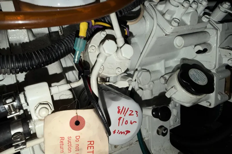 Slide: The Image of Engine compartment of a 1998 Sabreline 36 Fast Trawler with visible components and wiring. - 42