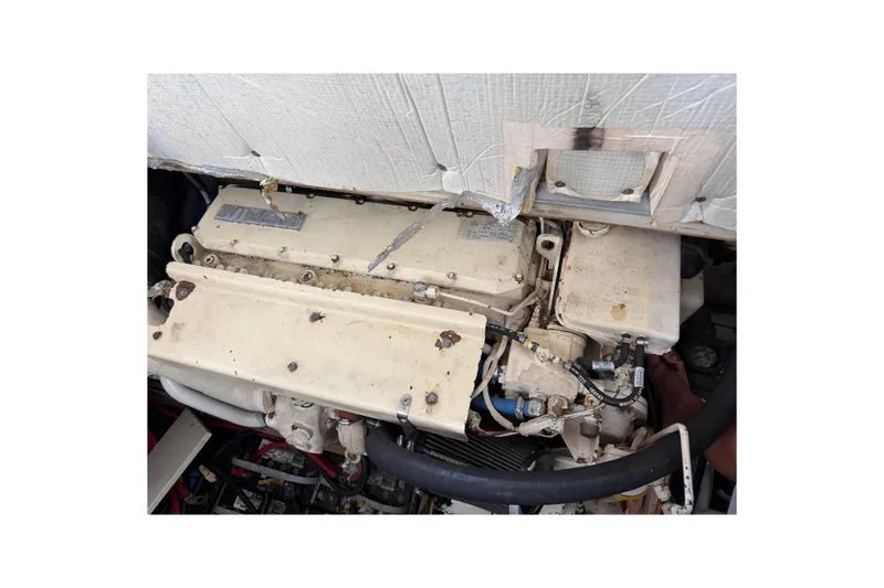 Slide: The Image of Engine compartment of a 1998 Sabreline 36 Fast Trawler, showcasing mechanical components. - 36