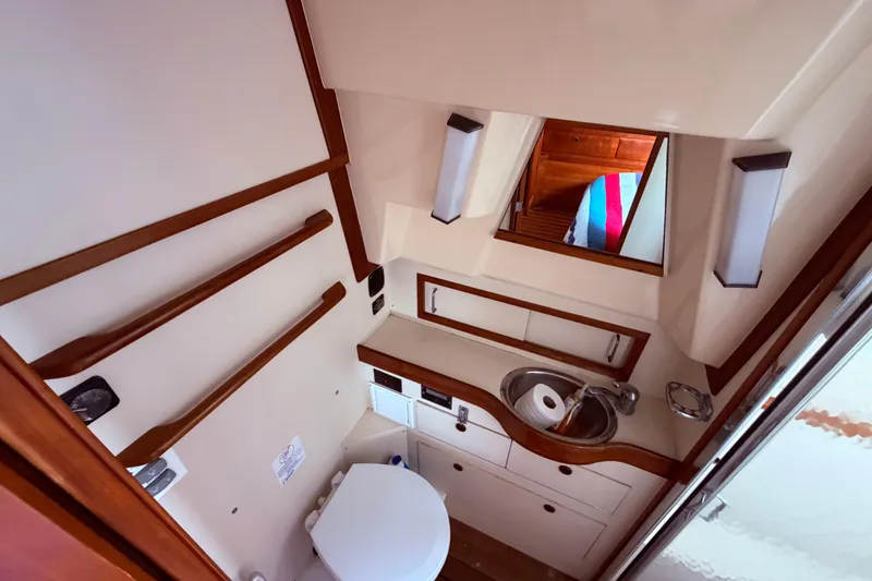 Slide: The Image of Bathroom interior of 1998 Sabreline 36 Fast Trawler with sink and toilet. - 31