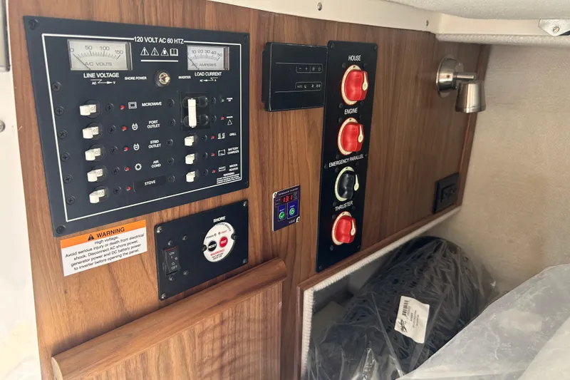 Slide: The Image of Electrical control panel in a 2027 Solara S-250 Coupe, featuring various switches and gauges. - 26