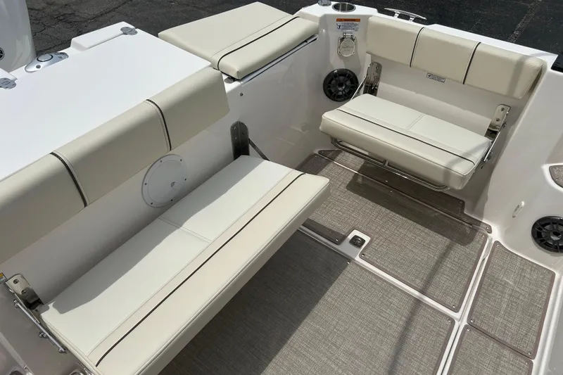 Slide: The Image of Interior seating of 2027 Solara S-250 Coupe boat, featuring beige cushioned seats. - 7