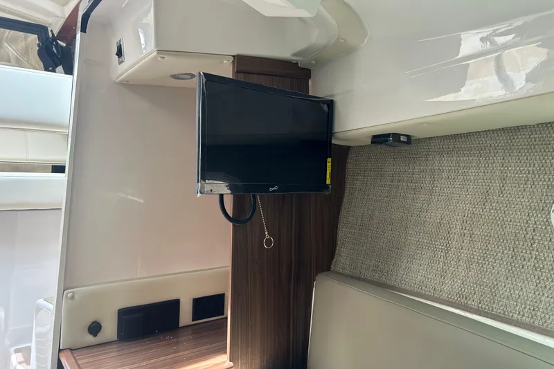Slide: The Image of Interior of 2027 Solara S-250 Coupe featuring a mounted TV and modern design elements. - 21