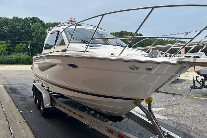 Slide: The Image of 2027 Solara S-250 Coupe boat on trailer, parked outdoors. - 6