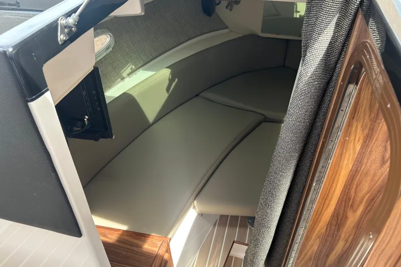 Slide: The Image of Interior cabin of 2027 Solara S-250 Coupe, featuring sleek seating and wood accents. - 20