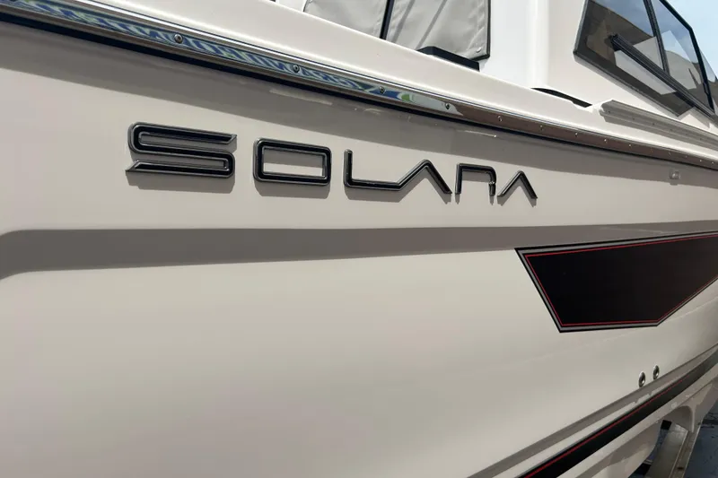 Slide: The Image of 2027 Solara S-250 Coupe boat side view with sleek design and logo. - 5