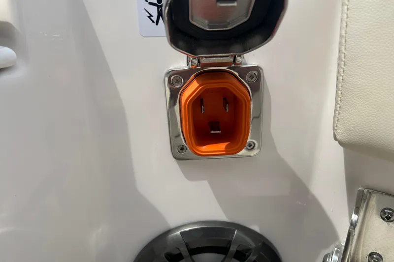 Slide: The Image of Orange power outlet on 2027 Solara S-250 Coupe, close-up view. - 25