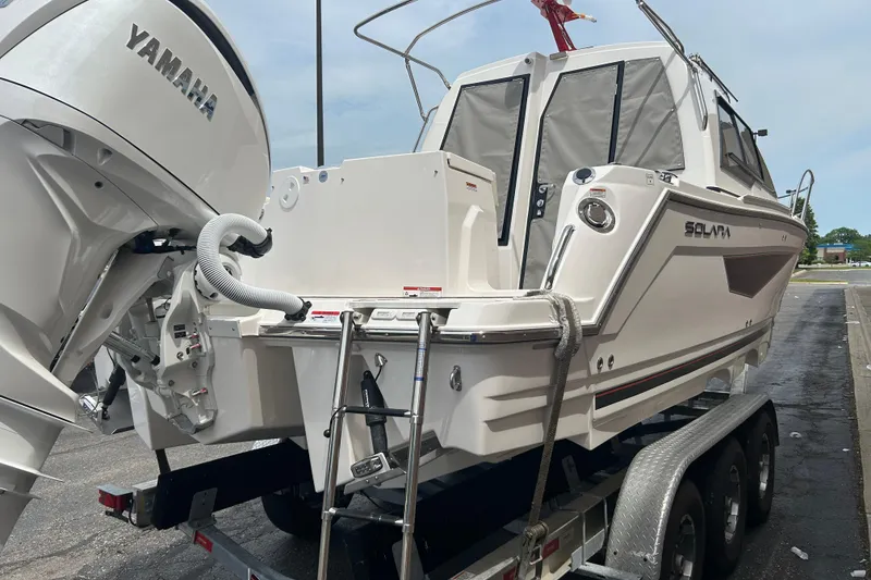 Slide: The Image of 2027 Solara S-250 Coupe boat on trailer with Yamaha engine. - 4
