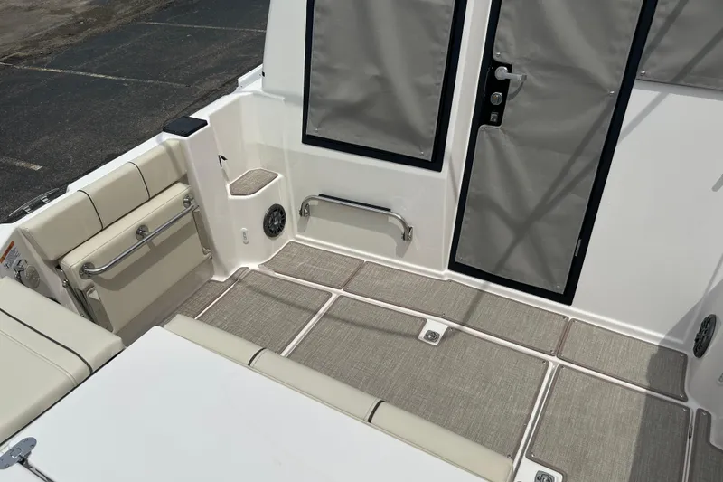 Slide: The Image of Interior view of 2027 Solara S-250 Coupe boat with beige seating and modern design. - 8