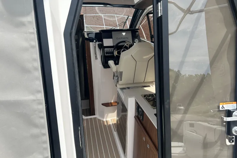 Slide: The Image of Interior view of 2027 Solara S-250 Coupe boat cockpit with Garmin navigation system. - 10