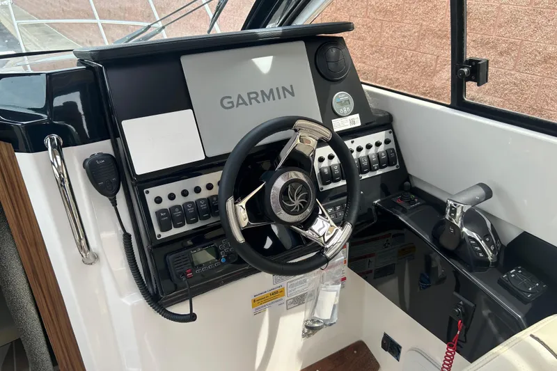 Slide: The Image of Helm of 2027 Solara S-250 Coupe featuring Garmin navigation and modern controls. - 13