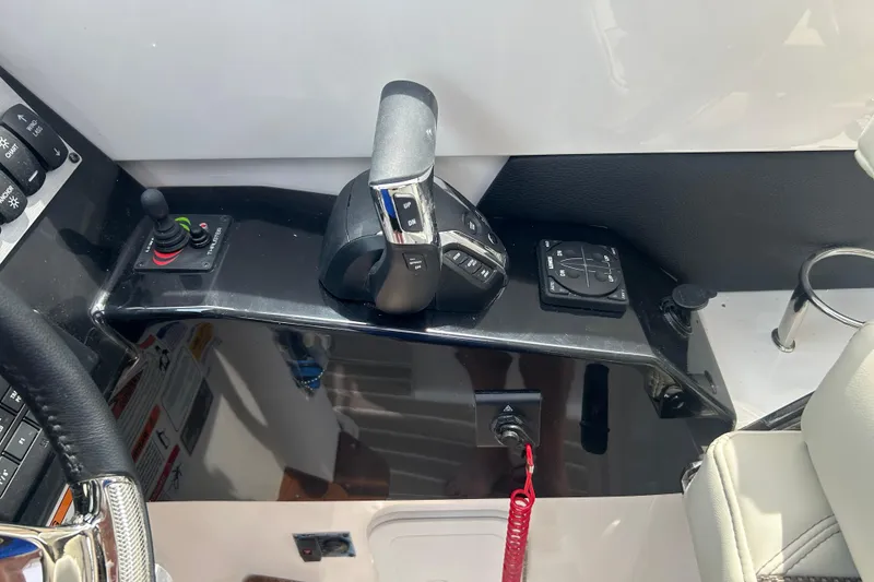 Slide: The Image of Control panel of a 2027 Solara S-250 Coupe, featuring joystick and throttle controls. - 14