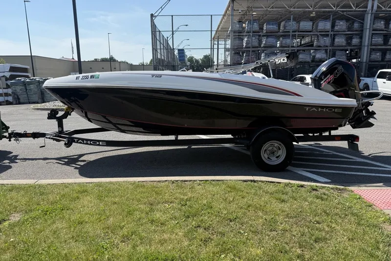 Slide: The Image of 2024 Tahoe T18 boat on trailer in parking lot, side view. - 3