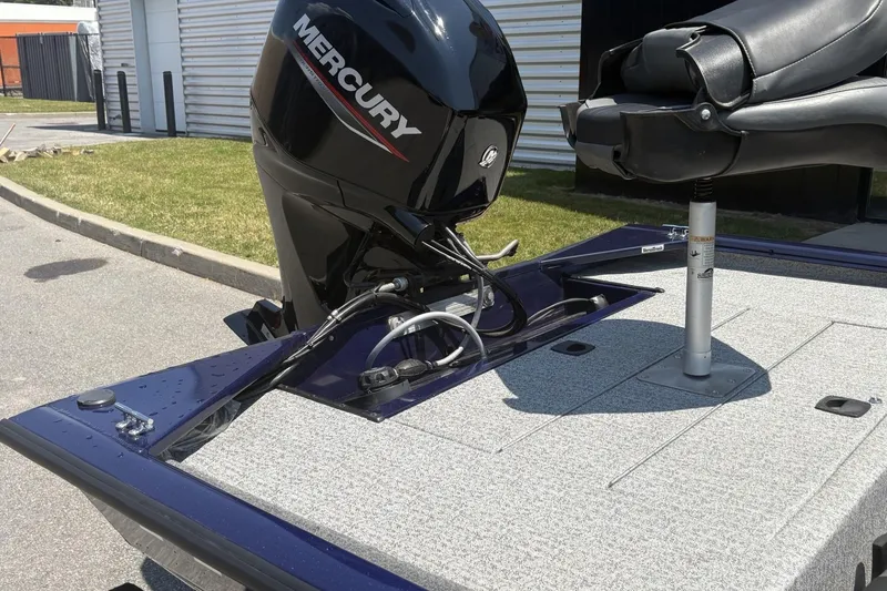 Slide: The Image of 2020 Tracker Pro 170 boat with Mercury engine and swivel seat on a sunny day. - 6