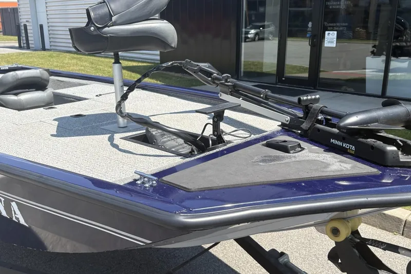 Slide: The Image of 2020 Tracker Pro 170 boat with Minn Kota trolling motor, outdoor setting. - 4
