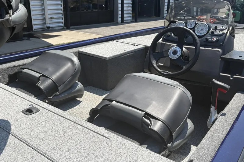 Slide: The Image of 2020 Tracker Pro 170 boat interior with steering wheel and seating. - 7
