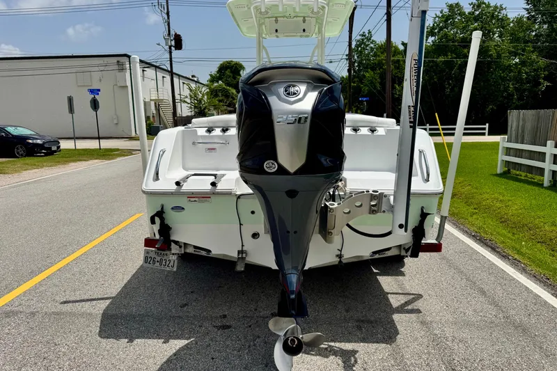 Slide: The Image of 2015 Sea Hunt Ultra 234 boat with Yamaha outboard motor on a street. - 3