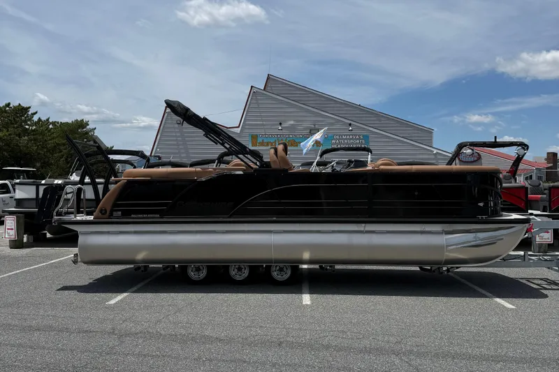 The Image of 2026 Berkshire 23RFX STS pontoon boat parked outdoors on a sunny day. - 0