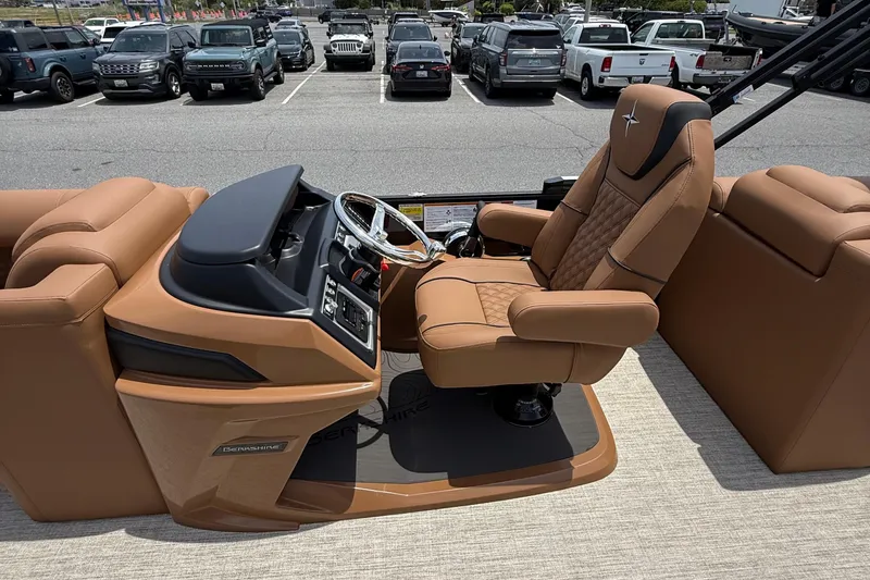 Slide: The Image of Luxurious interior of 2026 Berkshire 23RFX STS boat with tan leather seating and modern dashboard. - 11